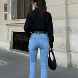 Sky blue bell bottom jeans | Black shirt | Womens
